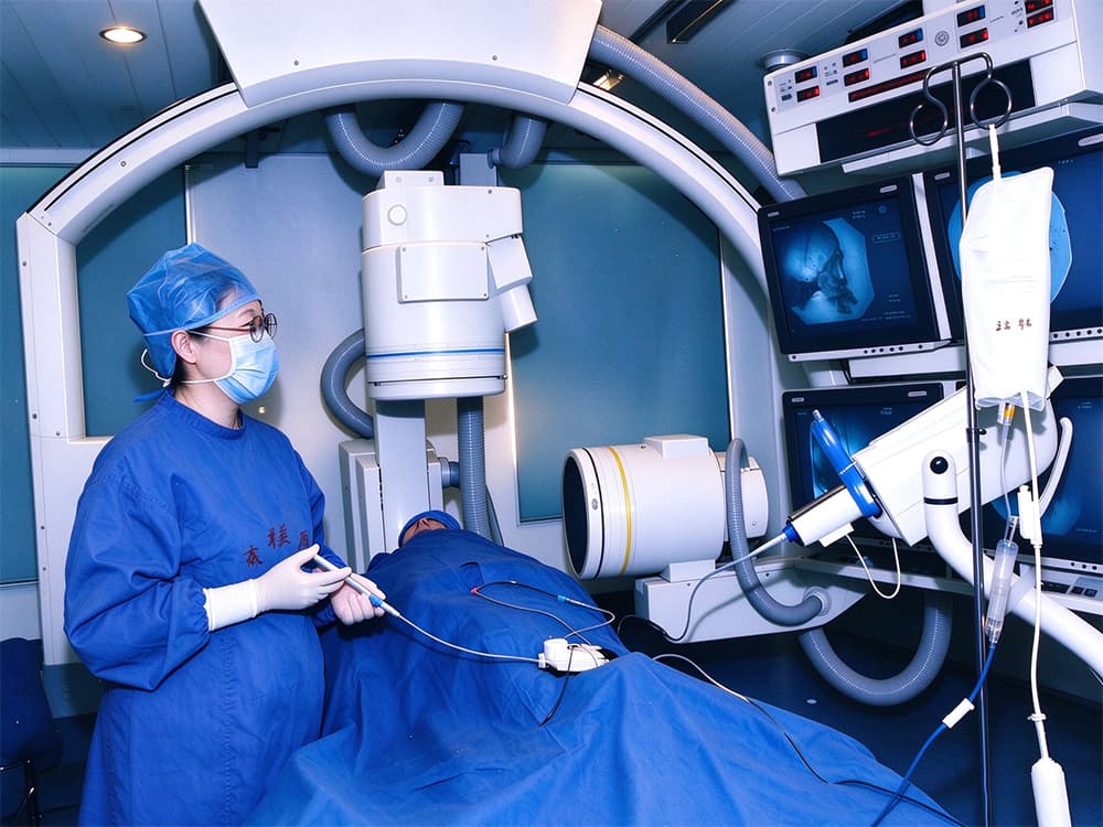 Professor Ling Feng performing an interventional procedure